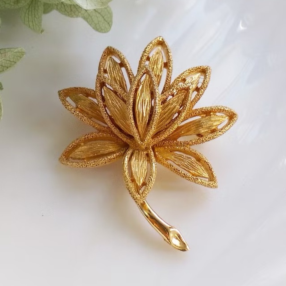 Vintage Gold Tone Flower Avon Costume Brooch Pin in a Satin and Polished Finish